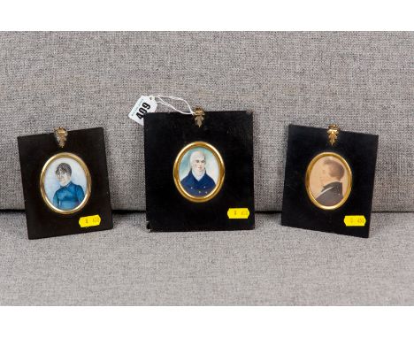 A group of three 19th Century portrait miniatures in black papier mache frames, all oval shaped miniatures of a side profile 