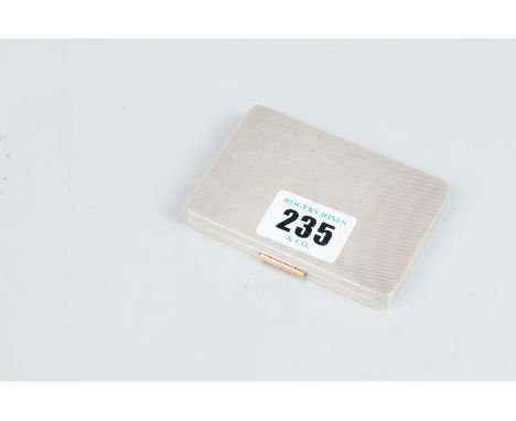 A card case - an engine turned oblong silver card case with gilt interior, 3.3 ozs, Birmingham 1940