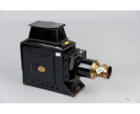 A black japanned Magic Lantern with brass fittings, patent no. 1857 and retailed by Newton & Co Opticians, London, 13 x 18 in