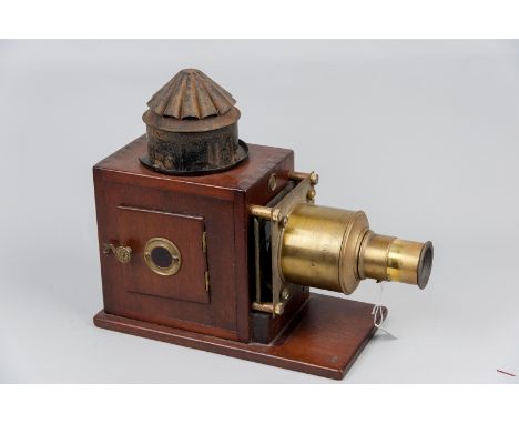 A Victorian mahogany and brass Magic Lantern (later converted for electricity) of traditional design by E C Atkins & Co, Indi