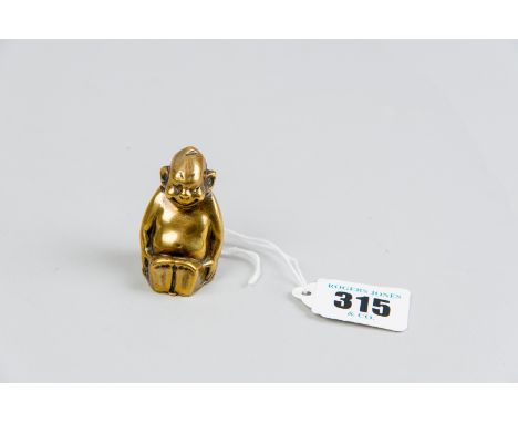 An unusual brass vesta case in the form of a seated monkey and bearing the stamped letters 'U S P, October 6th '08, D R G M'