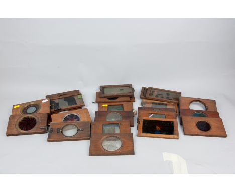 A collection of fifty plus Magic Lantern slides in wooden frames including three mechanical kaleidoscope and multi-picture sl