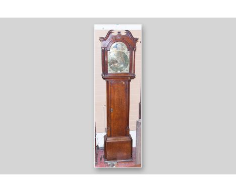 A 19th Century oak longcase clock, the arched hood with twin broken pediment and reeded columns flanking an arched glazed doo