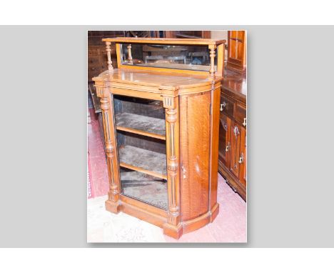 A good quality late Victorian oak side cabinet, small mirrored back top with single shelf supported by turned pillars, curved