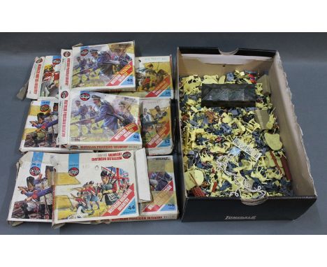 A box full of Airfix 00 scale military figure kits (some already assembled)