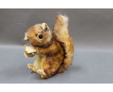 1960's Steiff "Perri" squirrel, size 17cm, with raised Steiff script button to ear