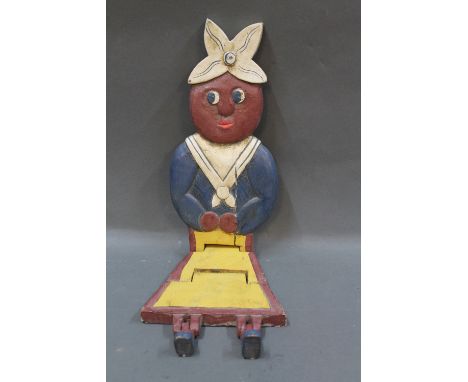 A wooden painted shelf doll