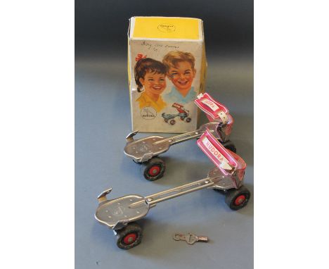 A box of vintage Hudora roller skates 