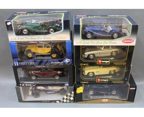 A group of 8 boxed 1:18 scale diecast model cars Burago, Kyosho, Maisto and others  