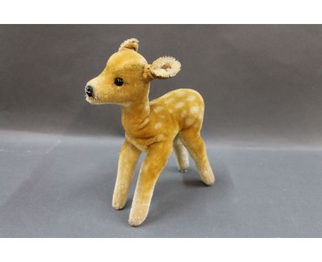 A 1950's/60's Steiff fawn, size 22cm, with raised Steiff script button to ear