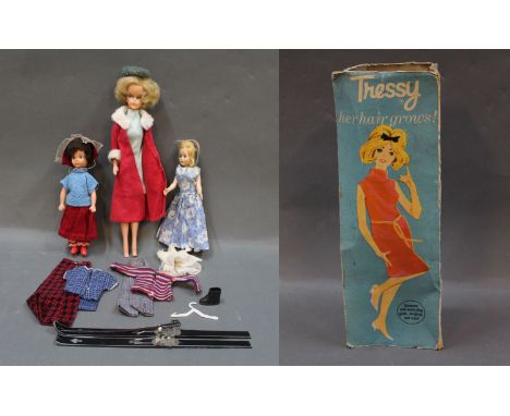 A vintage vinyl doll (possibly Tressy, 12ins in height), 2 other dolls, a Tressy doll box & a small collection of Tressy doll