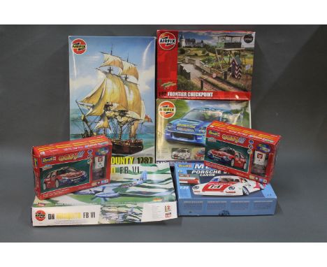 7 boxed model kits by Airfix & Revell. Parts still attached to frames