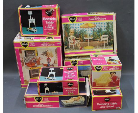 A group of 7 boxed Pedigree Sindy accessories, bedroom furniture and kitchen appliances: Bedside table and lamp (x 2), armcha