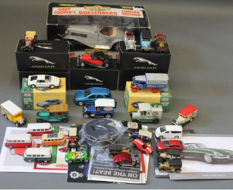 A collection of boxed and unboxed diecast model vehicles, including Atlas Editions and American Muscle Classics, and Jaguar l