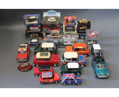 A collection of boxed and unboxed die cast model Mini cars by Corgi, Burago and Lledo etc  