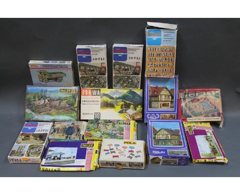 A group of 14 model kits consisting of Faller, Preiser & Airfix. Boxes have been opened but models aren't assembled    