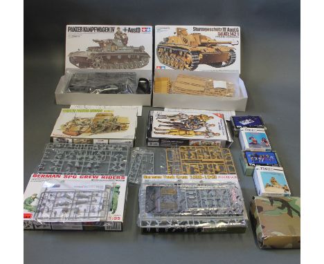 11 boxed model kits, all still on frames, including Tamiya, Dragon, Verlinden etc
