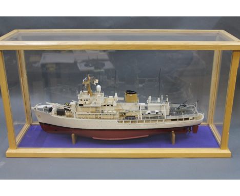 A cased model of HMS Herald, case measuring 101cmx52cmx33cm