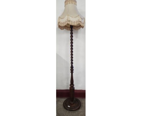 An early 20th Century oak barleytwist standard lamp 