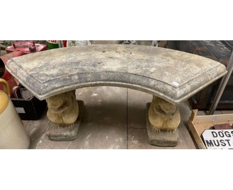 A concrete pedestal garden bench 