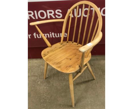 An Ercol Blonde elm and beech windsor armchair 