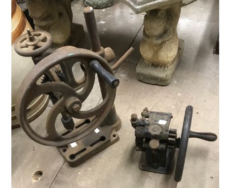 A vintage hand press and a pillar drill 