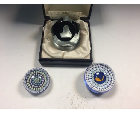 Two Whitefriars Caithness concentric millefiori glass paperweights, one with central 'Sherlock Holmes Pipe', the other dated 