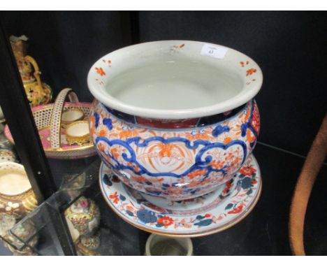 An Imari planter, circa 1900, and a pair of 18th century Chinese Imari plates  