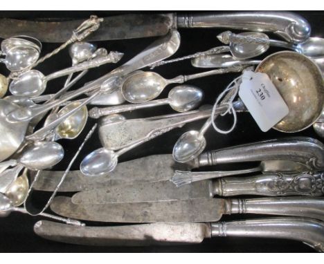 Four 18th century pistol handle knives, a William IV sauce ladle and various silver teaspoons  