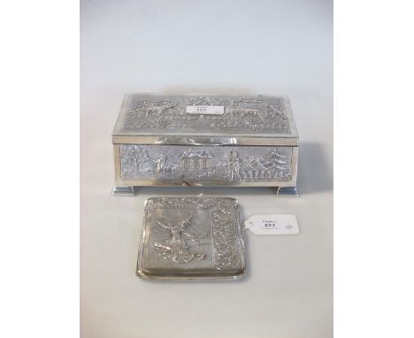 A Far Eastern cigarette box marked 'sterling', with raised landscape decoration, 17cm wide, and a Thai cigarette case, part s