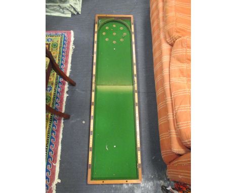 A folding bagatelle board  