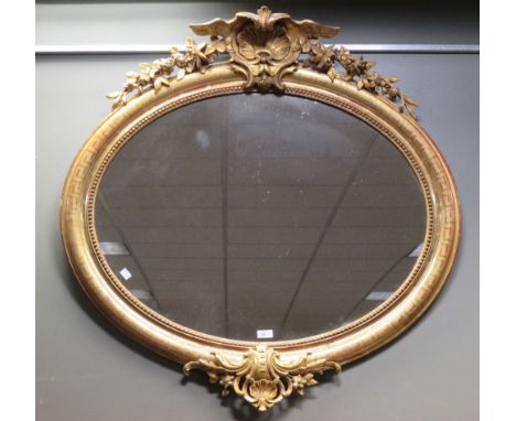An oval mirror in gilt frame  