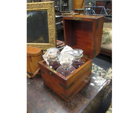 An Irish 19th century brass bound decanter box (one bottle damaged), with makers label Austin, Dublin, 26 x 23cm  -all show s