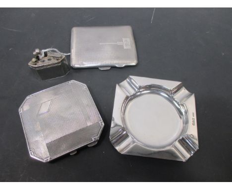 A silver cigarette holder, a silver compact, ashtray and lighter (4)  