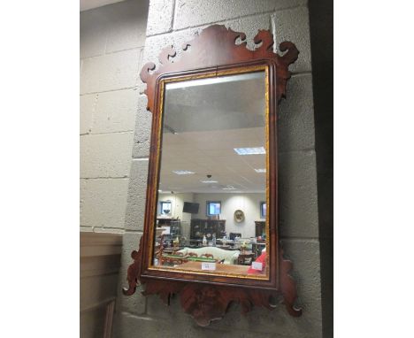 A walnut rectangular fret framed mirror 84 x 49cm (33 x 19in)  