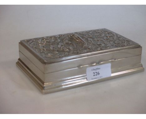 An embossed cigarette box stamped 'silver' to base  
