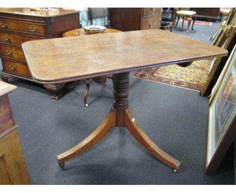 A Regency mahogany country made rectangular tripod supper table, on downswept legs  