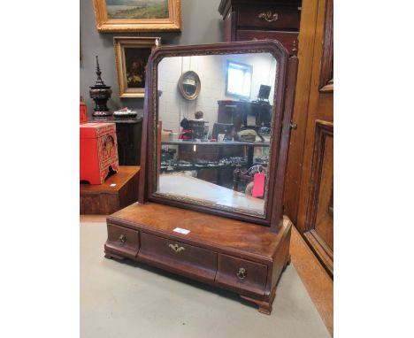 A mahogany dressing table mirror with three drawers  