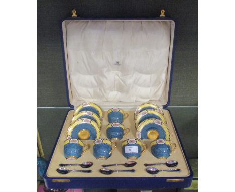 A Royal Worcester set of coffee cups and saucers with silver spoons, cased  Missing one spoon