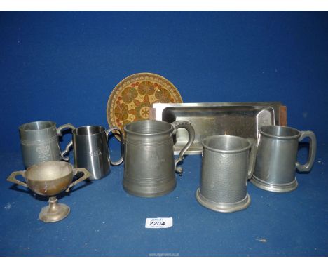 A quantity of miscellaneous metals including four pewter tankards, Danish stainless steel tray, brass enamel plate, trophy et