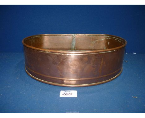 A semi circular Copper planter.