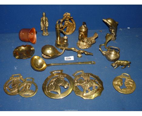 A quantity of brass ornaments including dolphin, water pump, miner, cobra, horseshoe door knocker, horse brasses, etc.