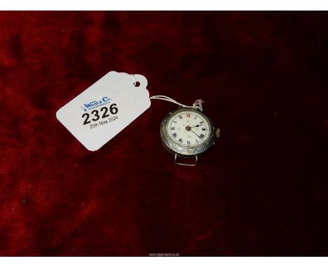 A silver cased watch with engine tuned rim to the dial that has Roman numerals.