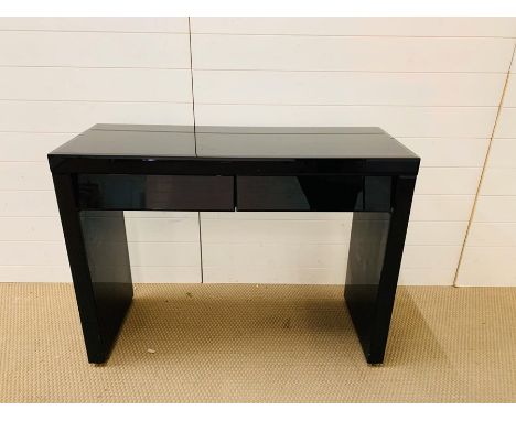 A black glass console table (H80cm W106cm D 40cm)