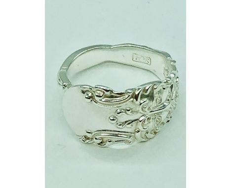 A hallmarked silver spoon ring handcrafted by Boochi and Co from antique silver cutlery, each ring being unique, (re-sizing a