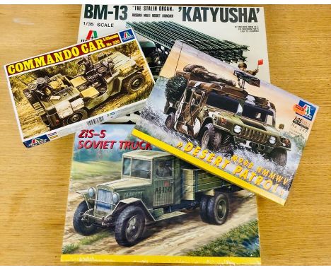 A selection of four boxed army truck kit by Italeri 