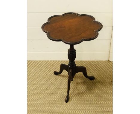 A small mahogany occasional table with flower shaped top on tripod pedestal base 