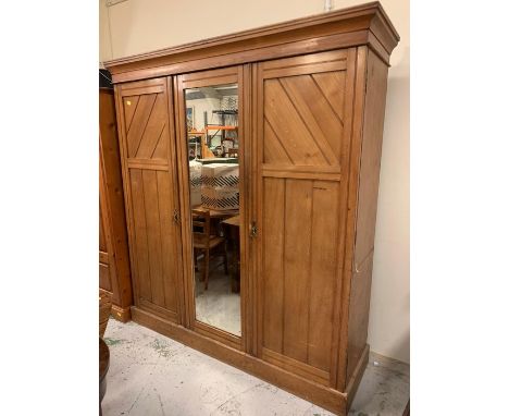 A triple light oak linen press with wardrobe to side 