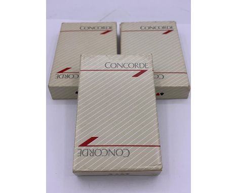Three packs of Concorde playing cards, one with cards still sealed.