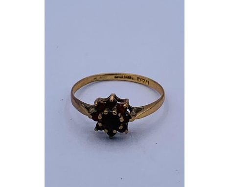 A 9ct gold and garnet ring